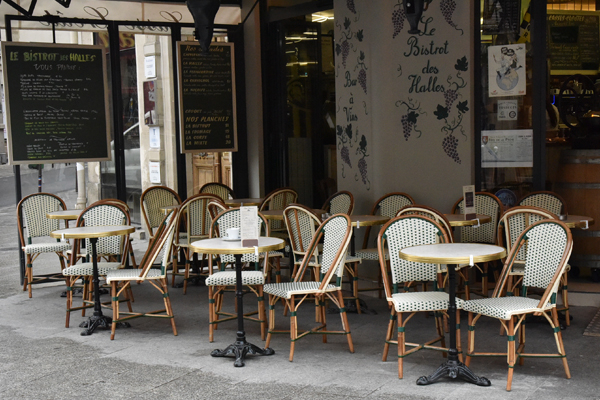 Typical parisian atmosphere A typical parisian terrace with its rattan chair
