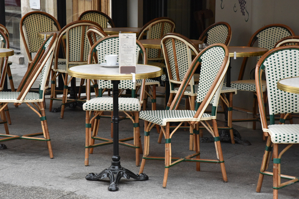 Typical parisian atmosphere A typical parisian terrace with its rattan chair