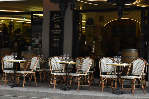 Typical parisian atmosphere A typical parisian terrace with its rattan chair